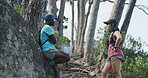Break, hiking and interracial couple with chat for fitness, trekking or adventure on mountain trail. Outdoor, hiker or people with conversation for travel, exercise rest or holiday and explore nature