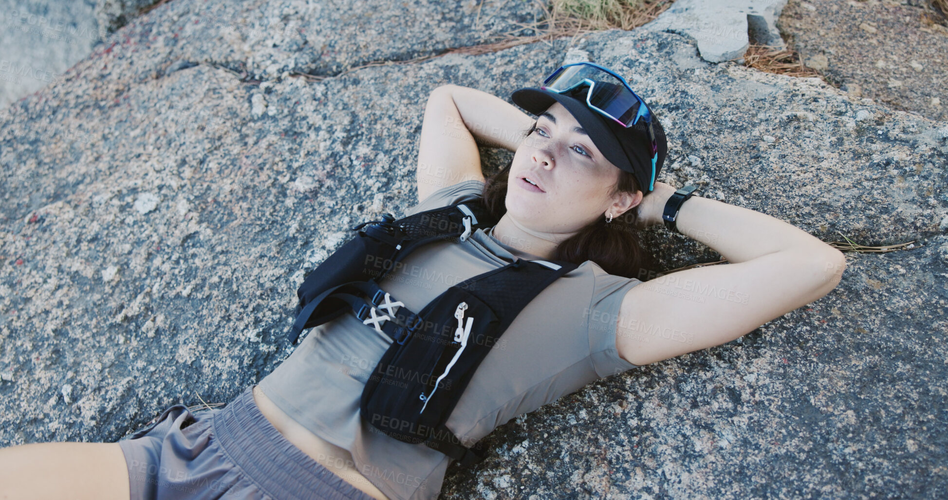 Buy stock photo Tired, woman and relax for fitness on rocks from exercise, intense training and recovery. Thinking, female person or exhausted with fatigue, athlete burnout and break in nature from challenge