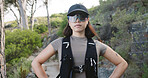 Outdoor, hiking and woman with glasses in woods, traveler and travel with hydration vest on vacation. Serious, hiker and person on holiday in nature, portrait and confident for exploration in Canada