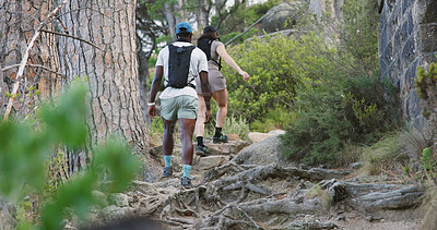Buy stock photo Back, couple and hiking in forest with fitness, adventure and exercise together for wellness goals. Active, people and walk on mountain with outdoor exploration, workout and interracial relationship.