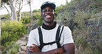 Portrait, hiking and happy man with arms crossed in woods, outdoor and confident with hydration vest. Hiker, smile and black person with hobby in nature, travel and vacation for adventure in Kenya
