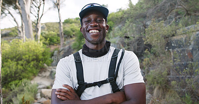 Buy stock photo Portrait, hiking and happy man with arms crossed in woods, outdoor and confident with hydration vest. Hiker, smile and black person with hobby in nature, travel and vacation for adventure in Kenya