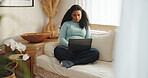 Education, student and woman with laptop in lounge, elearning and planning for assignment on website. Home, studying and person with tech for exam preparation, knowledge and serious with research