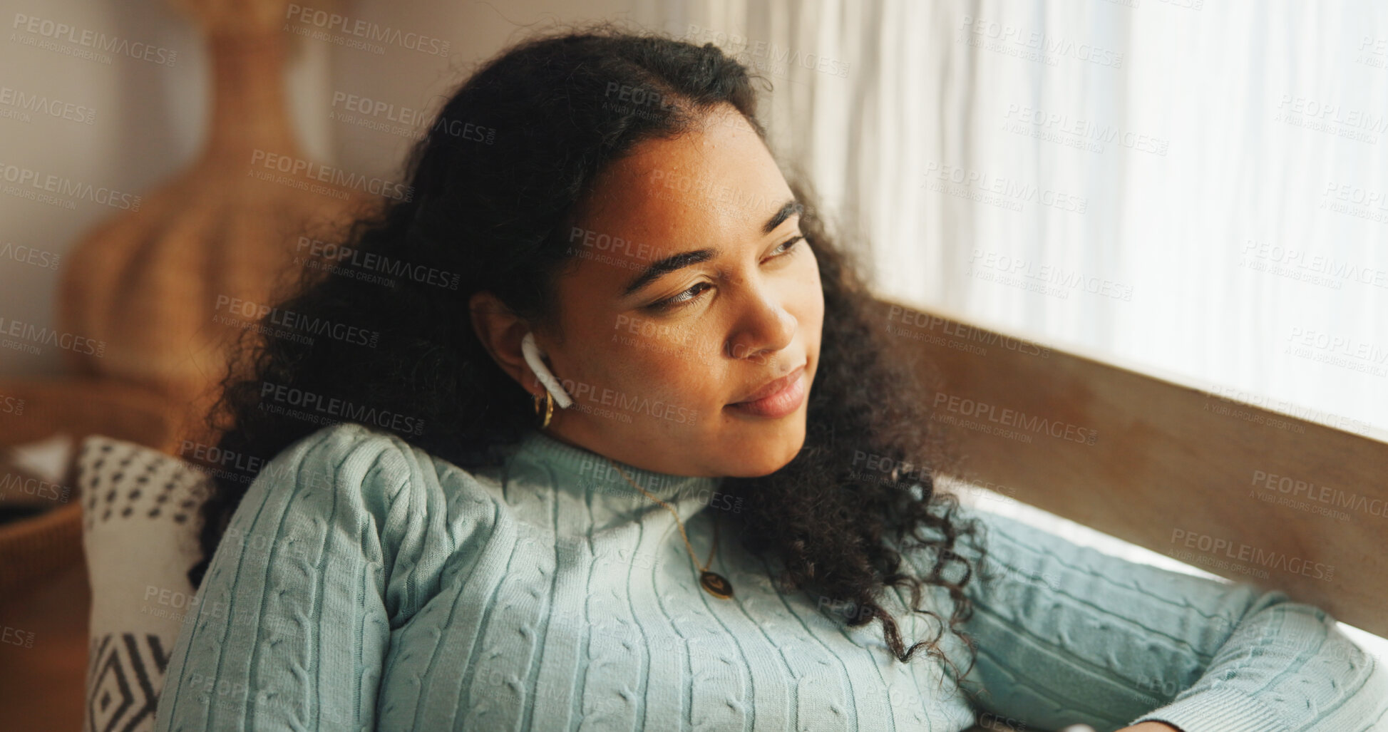 Buy stock photo Woman, thinking and relax with earphones in home, listening to podcast or reflection with smile. Person, calm or peace with audio tech for radio, music or audiobook entertainment with break at house