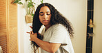 Beauty, bathroom or woman with hair care in morning, getting ready or length inspection for grooming. Styling, person or measure growth in home, curls maintenance routine or preparation for day