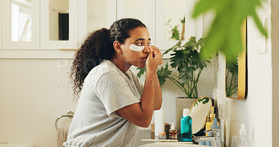 Buy stock photo Skincare, eye patch and woman in bathroom for dark circles reduction, hydration and beauty treatment. Mirror, self care and person with collagen product for dermatology or morning routine in home