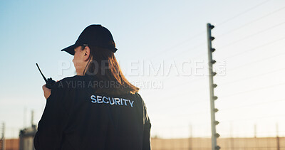 Buy stock photo Back, security and woman outdoor with radio for communication, surveillance and guard by fence. Protection, service and female person with tech for safety, perimeter search or patrol in nature