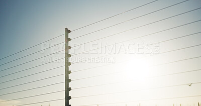 Buy stock photo Outdoor, safety and electrical fence with security, high voltage circuit and boundary for protection. Wire, barrier and system with powerline for prohibited entry, crime defense and access control.