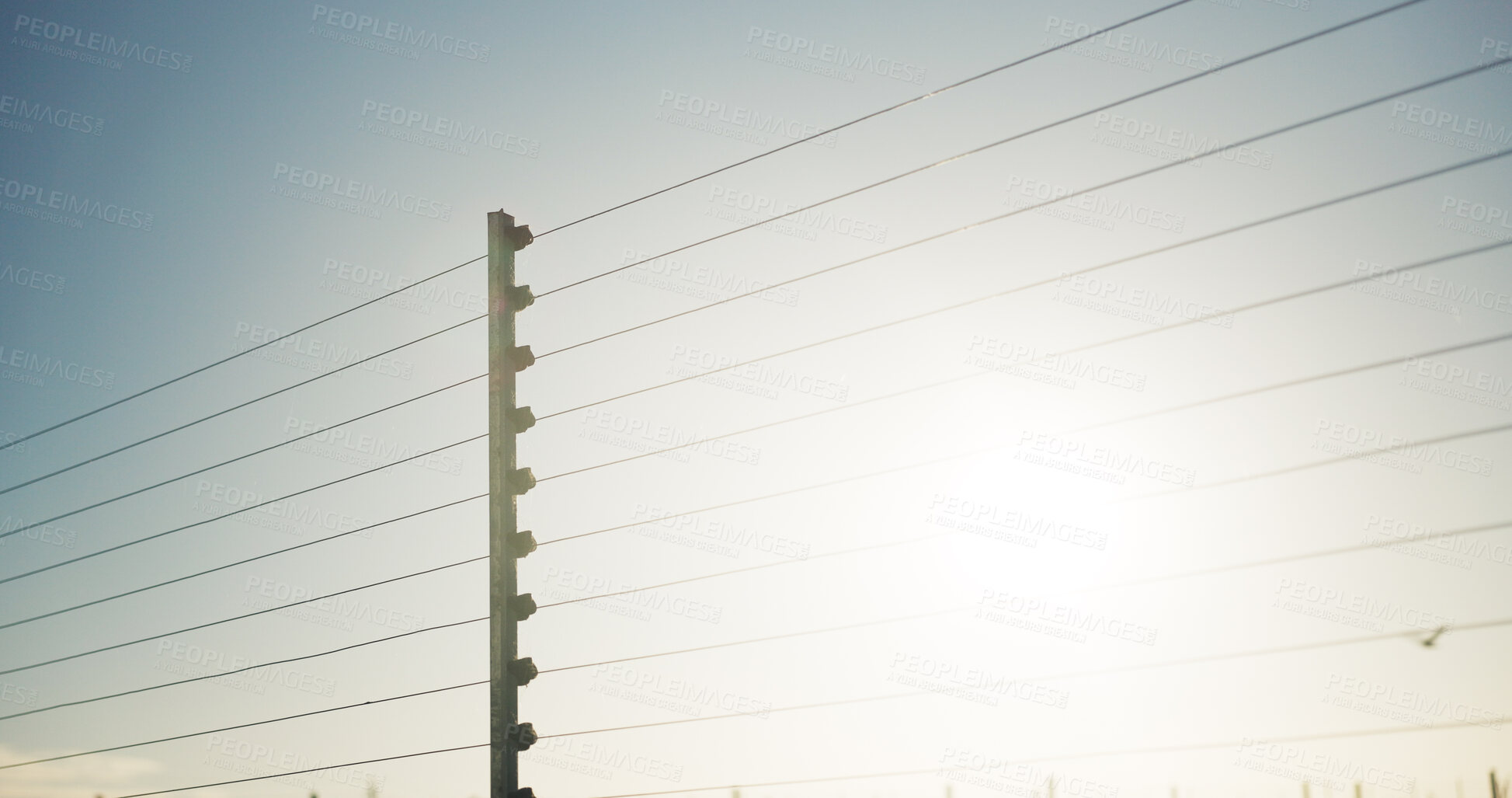 Buy stock photo Outdoor, safety and electrical fence with security, high voltage circuit and boundary for protection. Wire, barrier and system with powerline for prohibited entry, crime defense and access control.