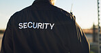 Back, guard and security with uniform outdoor for surveillance, authority and perimeter protection. Male person, radio and bodyguard services for access control, restricted area and threat detection
