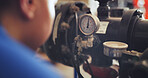Person, meter and power pump for water pressure, quality assurance or control in factory. Engineer, technician or mechanic checking system temperature for installation, repair service or maintenance