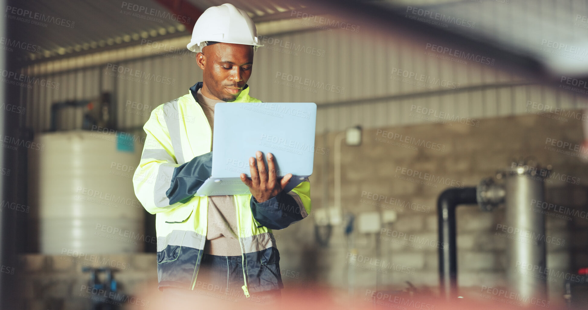Buy stock photo Engineer, laptop and black man in warehouse for hydraulic system, inspection and tank maintenance. Technician, water plant and person on computer for research, quality assurance and online checklist