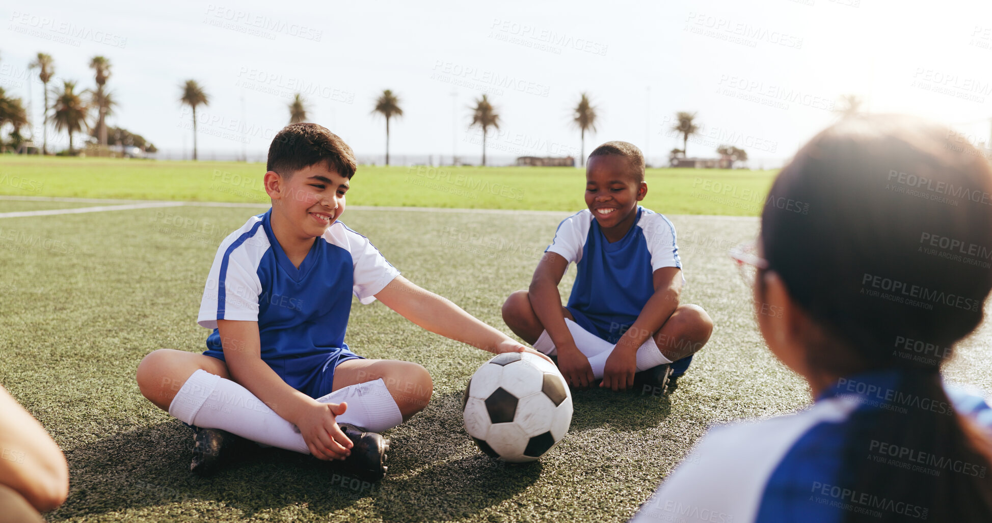 Buy stock photo Bonding, children or soccer team on field with ball, cool down or friendly match on weekend break. Fitness, rest or kids with happiness, football competition or socialising in childhood sports hobby.