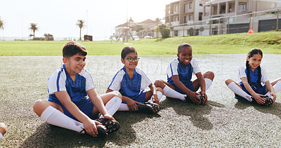 Buy stock photo Happy, children or soccer team on field with stretching, warm up or friendly match on weekend break. Fitness, smile or kids with preparation, football competition or injury prevention in sports hobby