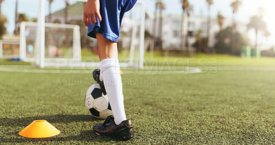 Buy stock photo Football field, fitness and legs with ball for kick, child and active for match or skill development. Kid, growth and training for soccer competition, outdoor and practice for wellness and sports