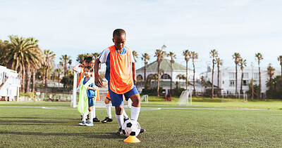 Buy stock photo Football field, fitness and child with ball for kick, team and active for match or skill development. Kids, growth and training for soccer competition, outdoor and practice for wellness and sports