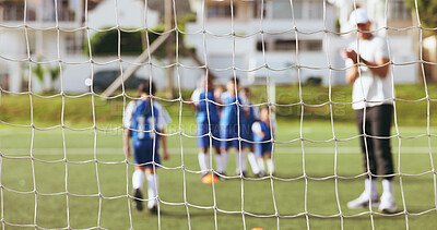 Buy stock photo Net, soccer and coach with kids for penalty shootout, football trial or sports day on grass field. People, children or team with cheering instructor or outdoor fitness drill for goal, score or point