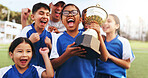 Excited, coach and children with trophy on field, soccer tournament success and celebration victory. Football team, winning game award and happy kids with man for achievement, competition or cheering