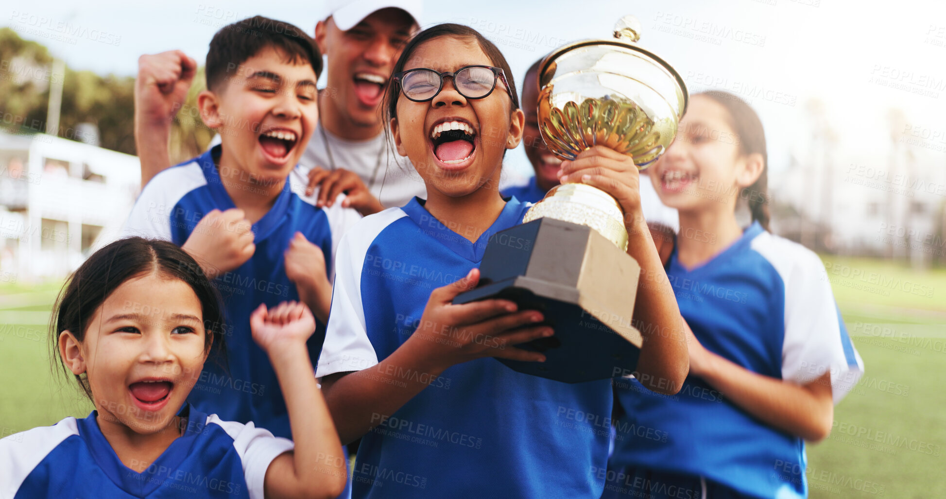 Buy stock photo Excited, coach and children with trophy on field, soccer tournament success and celebration victory. Football team, winning game award and happy kids with man for achievement, competition or cheering