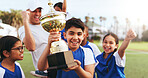 Happy, coach and children with trophy on field, soccer tournament success and celebration victory. Football team, winning game award and excited kids with man for achievement, competition or cheering
