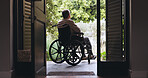 Back, thinking and wheelchair with old man at front door for reflection, retirement and memory. Mindfulness, grief and mobility accident with senior person with a disability in home for mourning 