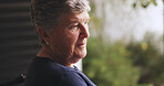 Sad, thinking and senior man by window with reflection, nostalgia and memory loss for dementia. Retirement, home and elderly person with depression, thoughtful and lonely with regret for Alzheimer
