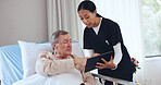 Hospital bed, tablet and nurse with senior man with medical results for recovery, healing or support. Healthcare, talking and woman with patient on tech for diagnosis, insurance form and consulting