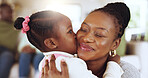 Kiss, love and mom with daughter in family home for bonding, support and mothers day. Happiness, trust and hug with black woman and child in living room of apartment for thank you and connection