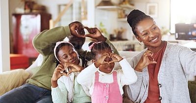 Buy stock photo Heart, selfie and African family on sofa in home for social media, online post and memory for bonding. Smile, happy and photo with mom, dad and girls with emoji for relationship, connection and love