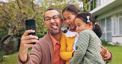 Buy stock photo Selfie, goofy and father with children in backyard at home for bonding, love and family time. Silly, connection and girl kids hugging dad for photography picture outdoor for fun together on weekend.