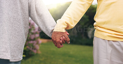 Buy stock photo Holding hands, love and senior couple in backyard for support, security or safety on weekend. Care, comfort and elderly people for connection outdoor in garden with trust in marriage together by home