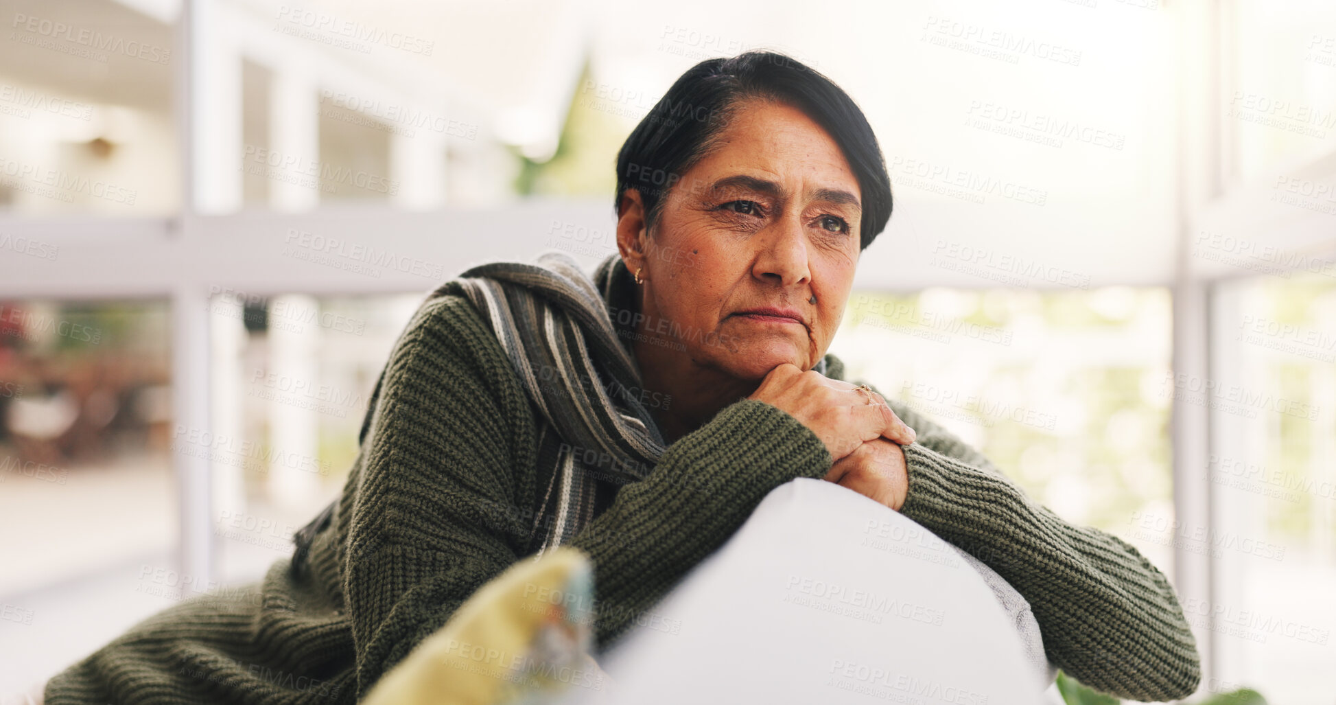 Buy stock photo Thinking, sad and mature woman on sofa in home for nostalgia, grief or memory with loss. Retirement, mental health and female person with depression in living room for planning future in house.
