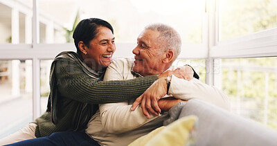 Buy stock photo Happy, hug and senior couple on sofa in home with love, care and marriage together on weekend. Smile, relax and elderly woman embracing man in living room for relationship, connection or bonding.