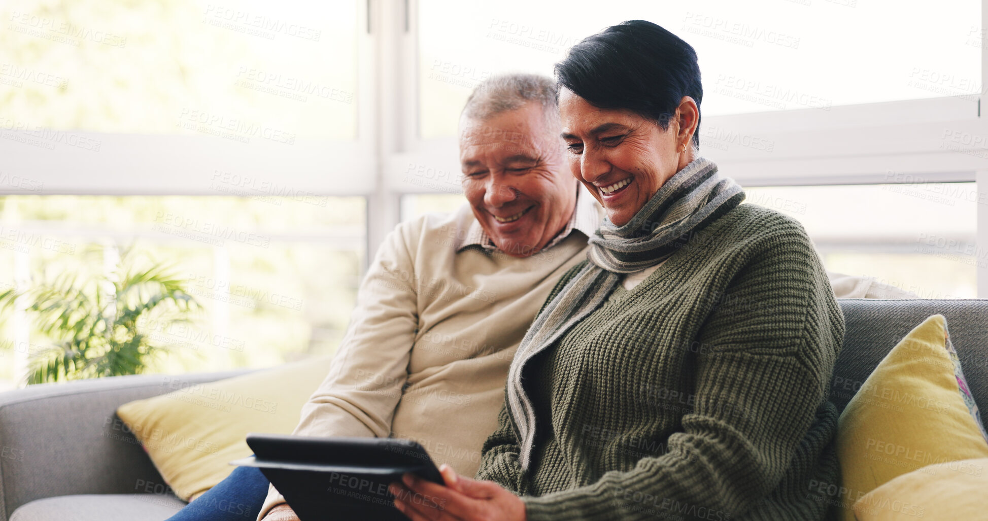 Buy stock photo Smile, tablet and senior couple on sofa in home with watching film show or series together. Happy, relax and elderly woman with man in living room for bonding with streaming movie on app in house.
