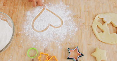 Buy stock photo Baking, heart and hands of person in kitchen for learning, culinary hobby and prepare dessert. Home, love emoji and above of baker with flour, ingredients and cutter for dough, treats and cookies