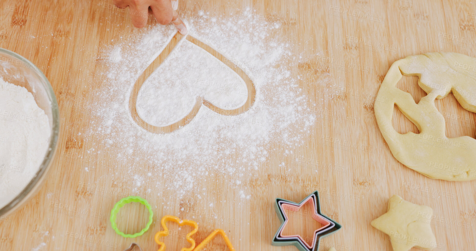 Buy stock photo Baking, heart and hands of person in kitchen for learning, culinary hobby and prepare dessert. Home, love emoji and above of baker with flour, ingredients and cutter for dough, treats and cookies