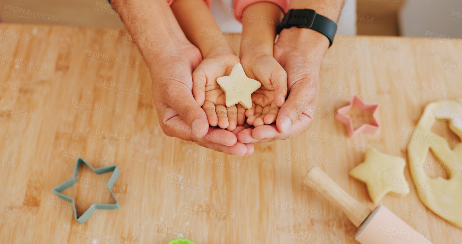 Buy stock photo Baking, star and hands of child with parent in kitchen for learning, help and bonding with dessert. Family, above and person with kid with ingredients, food and shape for dough, cookies and recipe