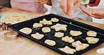 Baking, cookies and hands of children with parent in kitchen for learning, help and bonding in home. Family, sprinkles and person with kids with ingredients, food and tray for dough, treats or recipe