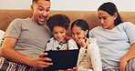 Tablet, happy and family on bed in home with watching movie, film or series on app on weekend together. Relax, digital technology and parents with children streaming show online in bedroom at house.