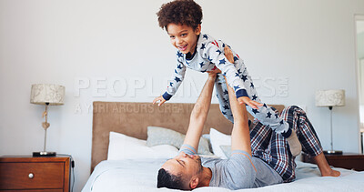 Buy stock photo Happy, flying and dad with child in bedroom for playing, bonding and relax together in morning. Family, home and father with boy for playful relationship, games and laugh for connection on weekend