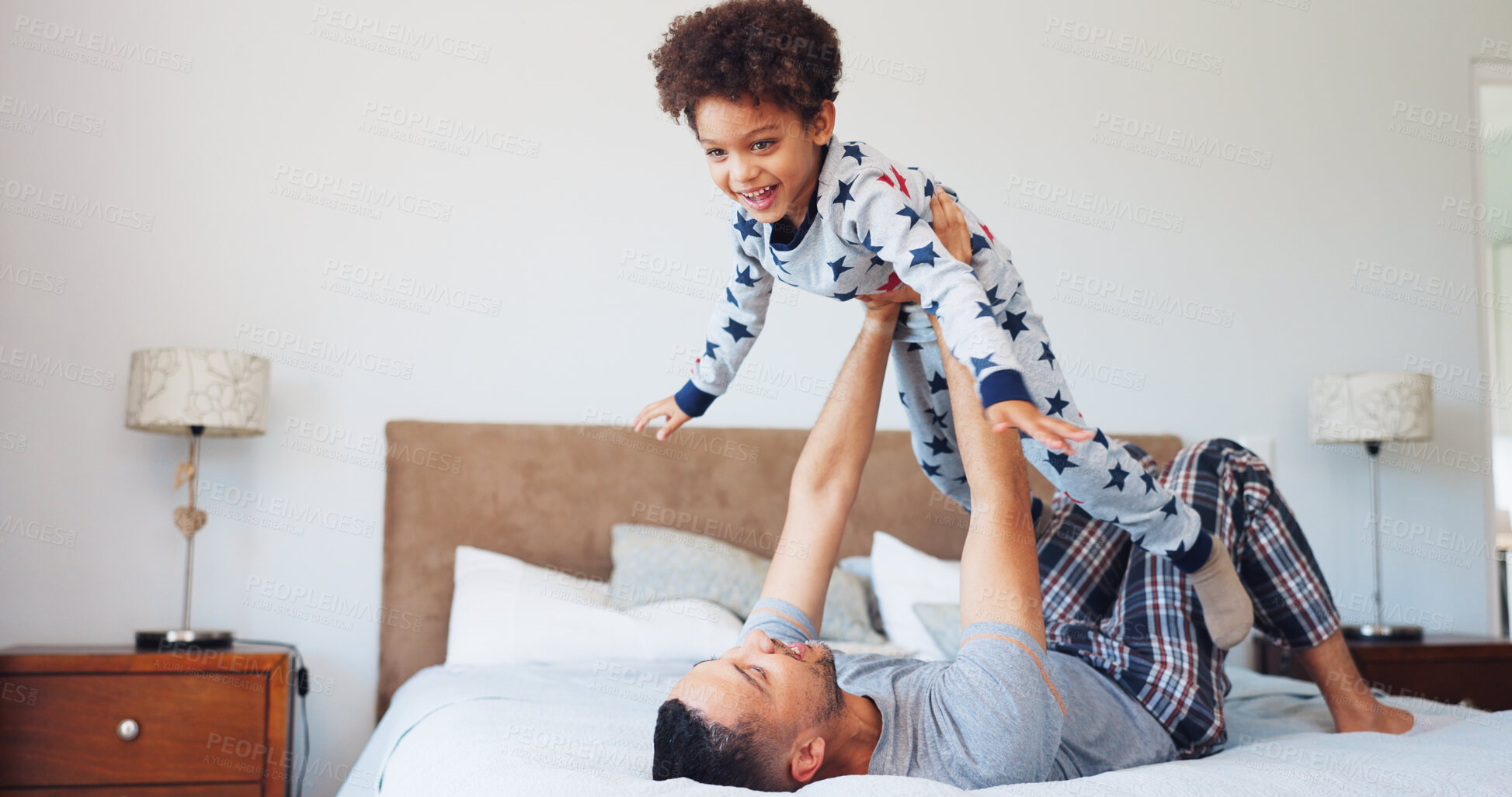 Buy stock photo Happy, flying and dad with child in bedroom for playing, bonding and relax together in morning. Family, home and father with boy for playful relationship, games and laugh for connection on weekend