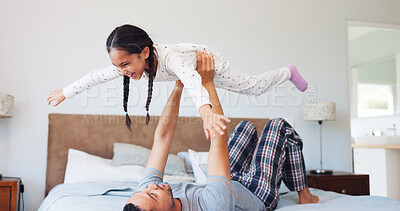 Buy stock photo Laugh, flying and dad with child in bedroom for playing, bonding and relax together in morning. Family, home and father with girl for playful relationship, games and happy for connection on weekend
