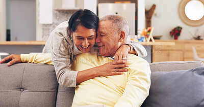 Buy stock photo Happy, hug and senior couple on sofa in home for bonding, marriage or connection on weekend. Smile, love and elderly woman embracing man in living room for trust, safety or care in apartment.