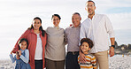 Happy, portrait and grandparents with kids at beach for bonding, love and connection on holiday. Family, ocean and children with mom, dad and senior generation for relationship, relax and vacation