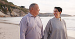 Happy, senior and couple at beach walking for holiday, vacation and relax on weekend. Love, marriage and man with woman holding hands by ocean, sea and nature for bonding, relationship and romance