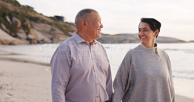 Buy stock photo Happy, senior and couple at beach walking for holiday, vacation and relax on weekend. Love, marriage and man with woman holding hands by ocean, sea and nature for bonding, relationship and romance