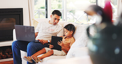 Buy stock photo Laptop, tablet and dad with child on sofa for internet, online streaming and connection on weekend. Family, home and father with boy on digital tech for website, watching videos and bonding together