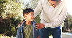 Happy, dad and bonding with child, backyard and conversation with boy on weekend break and together. Outdoor, man and discussion with son in nature, love and family with smile on holiday at house
