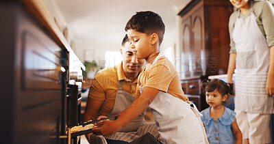 Buy stock photo Baking, oven and learning with family in kitchen in home for support, cookies and bonding together. Cooking, dessert and teaching with parents and children in house for guidance, care and recipe