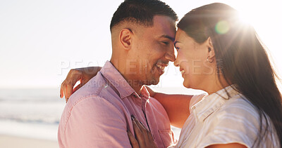 Buy stock photo Hug, smile and travel with couple at beach for connection, forehead touch and anniversary getaway. Marriage commitment, summer vacation and trust with man and woman for support, care and sunshine